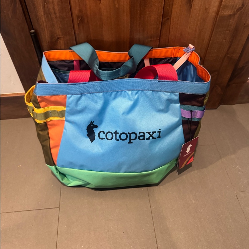 cotopaxi multicolor patchwork tote 60L - blue, green, orange, pink, purple